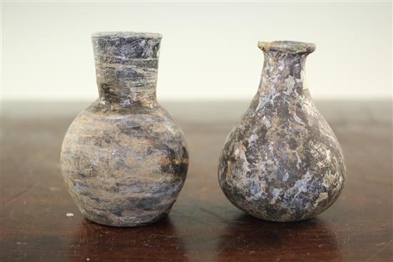 Two Syrian glass gourd flasks, c.6th century A.D., 8.5cm